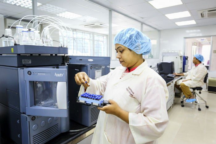 Analyst Tanzinah Nasrin operates a machine