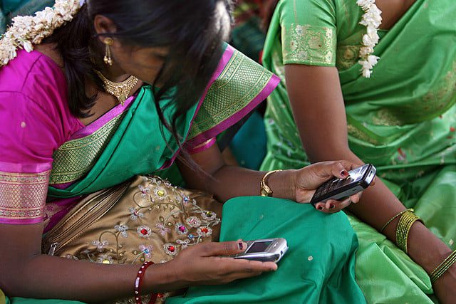 Checking_mobiles_Flickr_World Bank Photo Collection.jpg