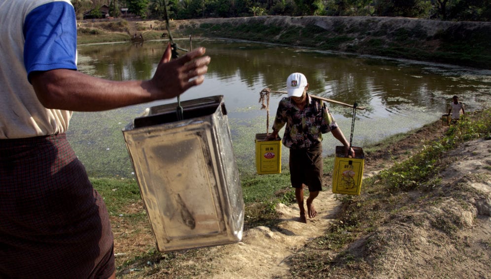 men hauling water from reservoir_panos