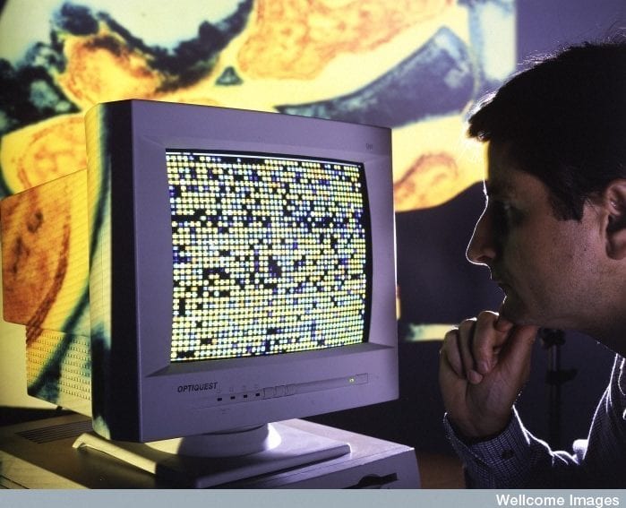 Scientist examining DNA (FILEminimizer).jpg