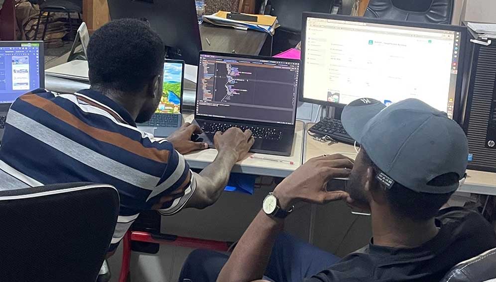 Developers looking at the code of the National Health Access Platform app