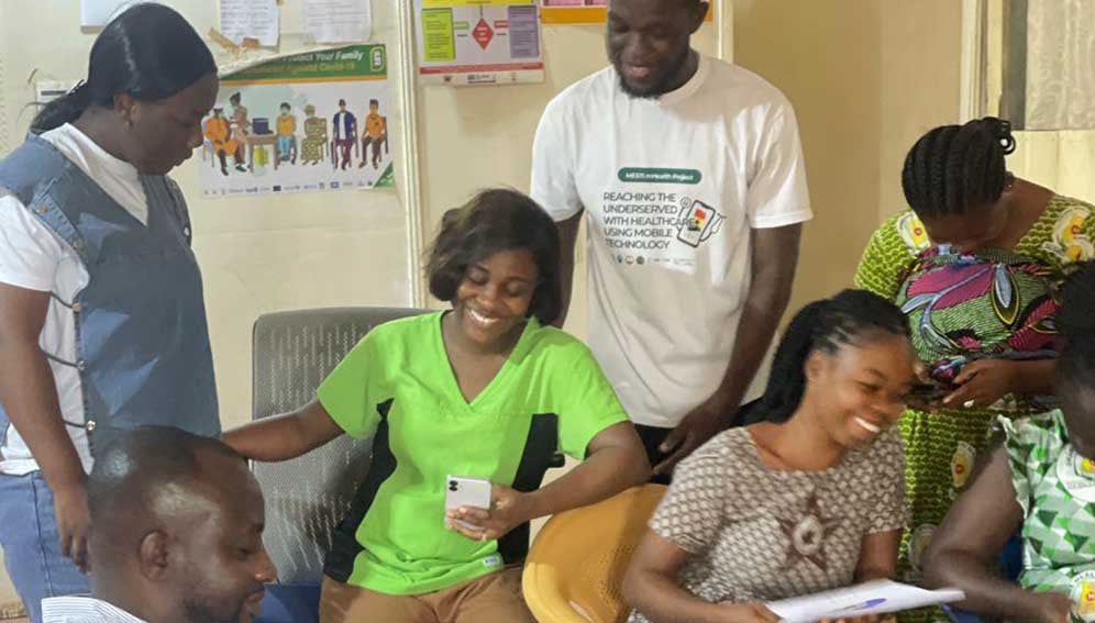 Dr. Rose-Mary Gyening interacting with rural health workers on how to use the app.