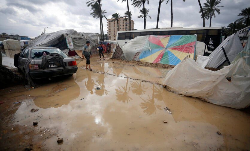 Residents are forced to create paths made of mud and bricks to facilitate their movement through the ponds of flooded camps