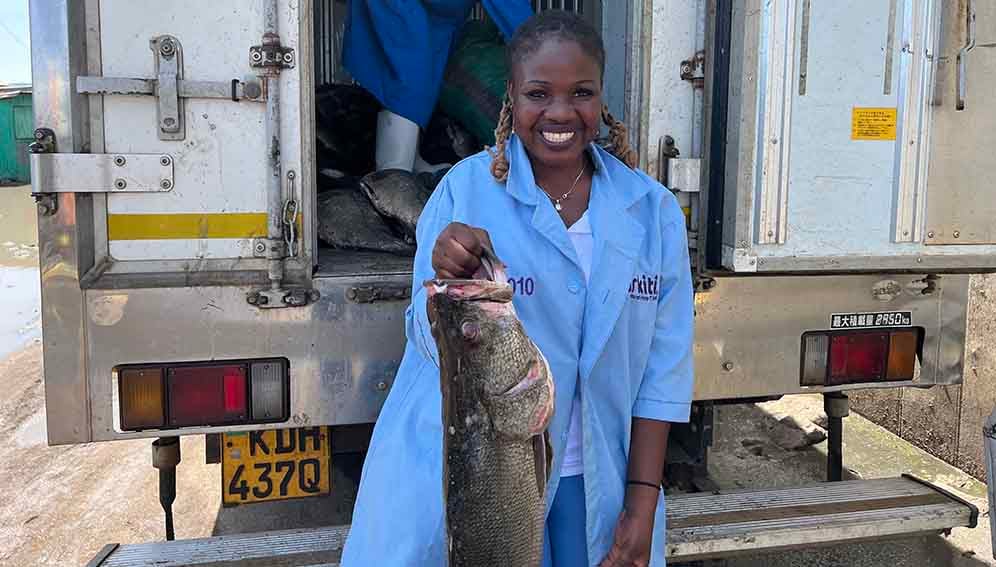 Keep It Cool fish quality control specialist based in Mbita, pausing with a large