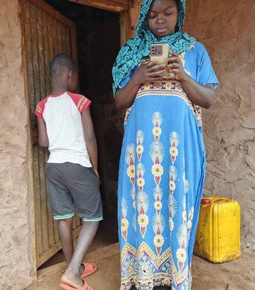 Salama Issa stands with her son at their home in the village of Mmongo, in Lindi region, Tanzania, where he is recovering from a dog bite. Copyright: Syriacus Buguzi