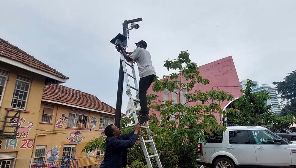 KCCA staff installing low cost air quality sensors near a school in Kampala city on 16th January 2024. Copyright KCCA