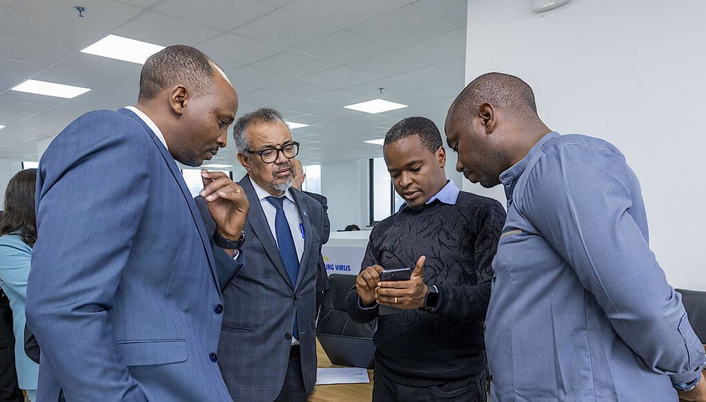 Andrew Muhire of MoH Rwanda demonstrates the Marburg surveillance platform to Dr. Tedros Ghebreyesus, WHO Director-General. Photo courtesy of Rwanda ministry of health.