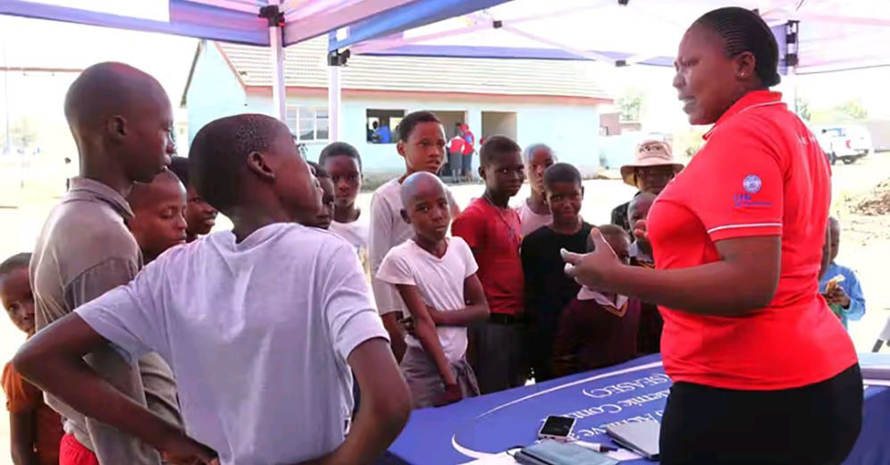 Nurse educates young girls on preventive measure.