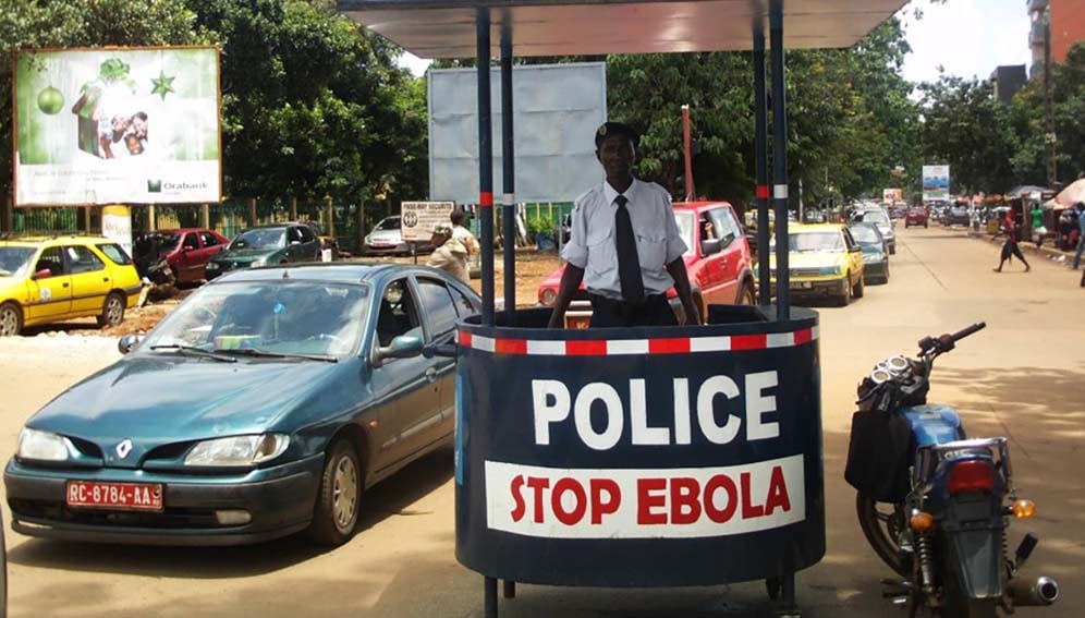 A police post with 'Stop Ebola' message.