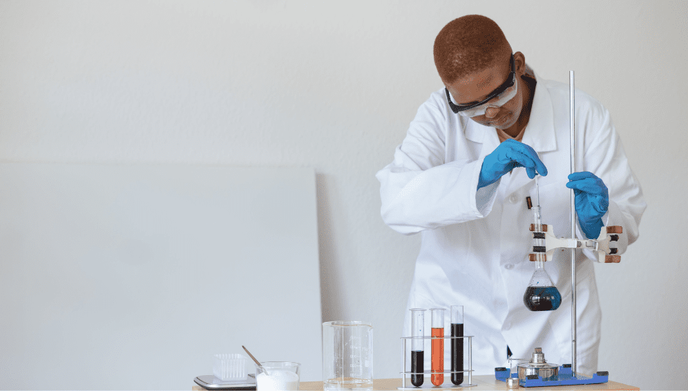 Teenage student conducting research in chemical laboratory. Research council supports South Africa’s young researchers.
