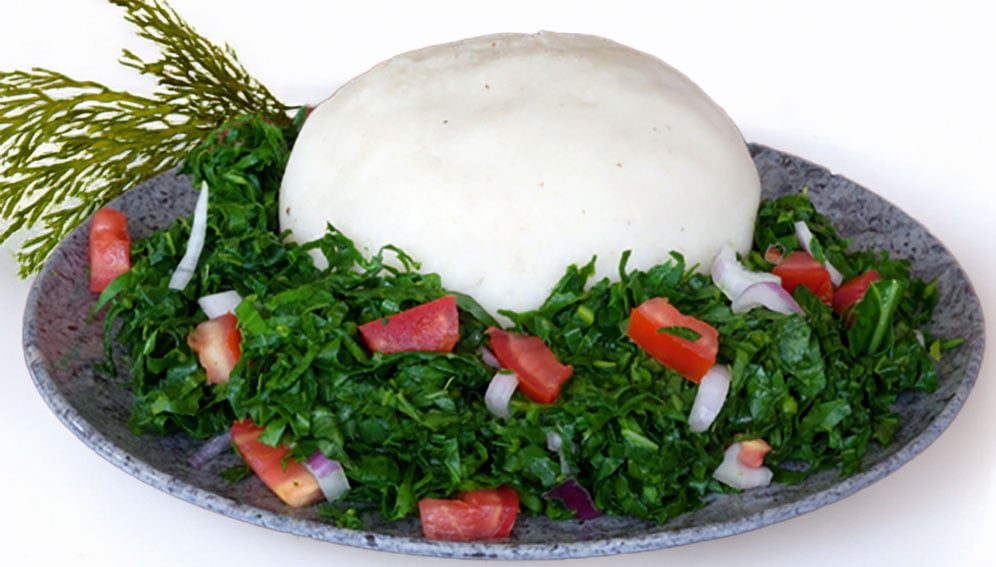 Maize meal ugali and sukuma wiki. Photo by Paresh Jai