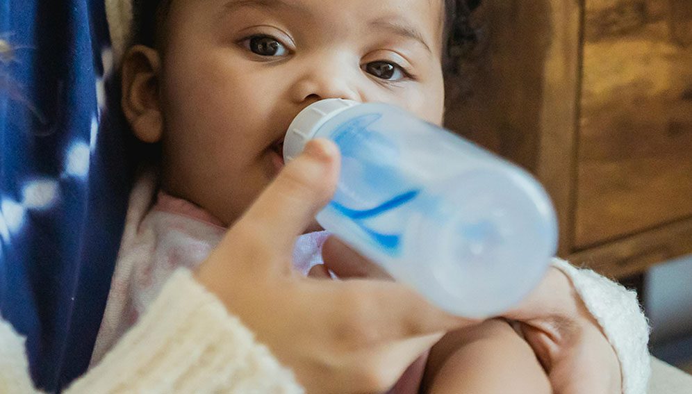 Mother feeding baby Photo by Keira Burton: https://www.pexels.com/photo/crop-mother-feeding-black-baby-6623854/