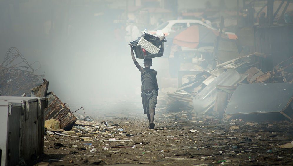 A young boy transported cables and other electronic devices in an old monitor. Source: Flickr