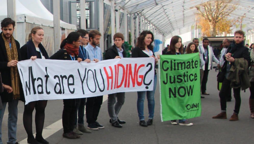 Youth's demo at COP21 in 2015. Link: https://www.flickr.com/photos/takver/23486305082/