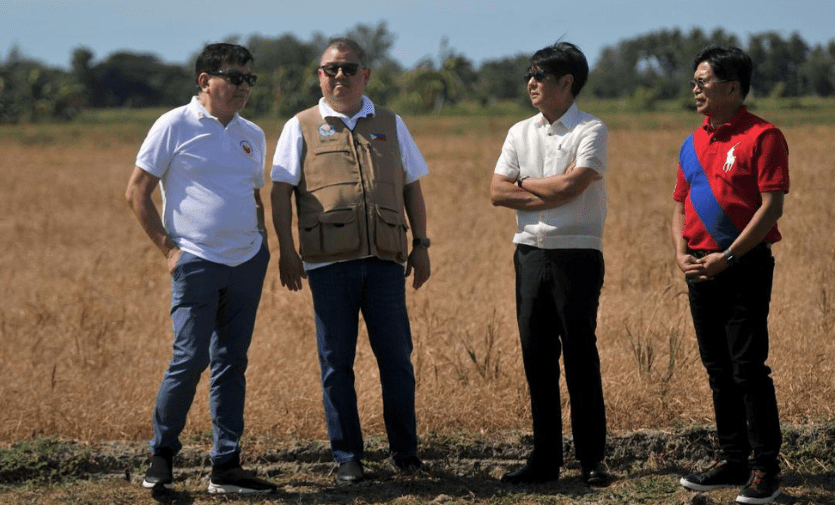 Philippine President Ferdinand Marcos Jr with Agriculture Secretary Francisco Tiu Laurel Jr visiting a hard-affected farm by El Nino.