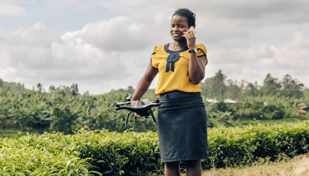 Woman, phone and drone